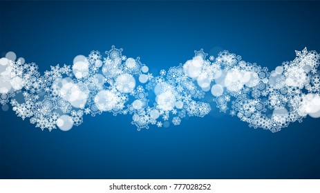 Christmas frame with falling snow on blue background. Horizontal Merry Christmas frame with white frosty snowflakes for banners, gift cards, party invitations and special business offers.