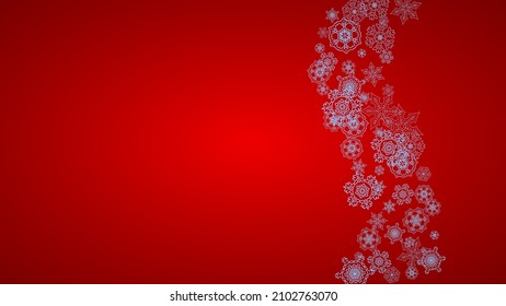 Christmas frame with snowflakes on red background. Santa Claus colors. Horizontal Christmas frame for holiday banners, cards, sales, special offers. Falling snow with bokeh and flakes for celebration