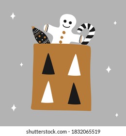 Christmas gift bag with gingerbread, candy and an icicle New year toy in scandinavian hand drawn style - gold, silver and black colors. Square vector illustration. Suitable for a greeting card