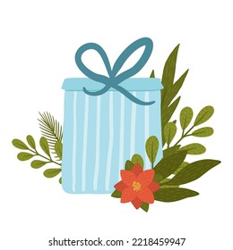 Regalo de Navidad en una caja azul con un arco y una flor roja. Decoración de invierno para Navidad. Postal de vacaciones.