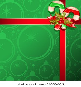 Christmas gift box with candy canes and holly berry