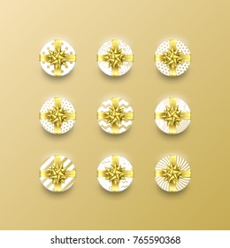 Christmas gift box present in golden ribbon bow and wrapping paper dotted pattern. Vector Christmas gold foil gift boxes set isolated on white background for New Year holiday or Birthday greeting card