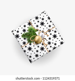 Christmas gift box top view. Realistic illustration. Black and white wrapping paper. Decoration of Christmas toys and Christmas branches. EPS10.