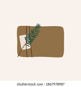 Christmas Gift box vector. Eco craft paper box with branch. Flat cartoon vector illustration. Isolated on white background. 