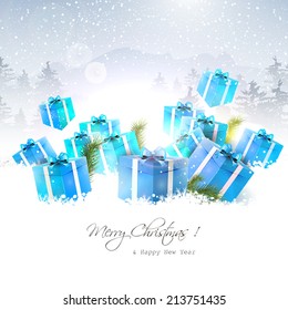 Christmas gift boxes in the snow with snowy landscape on the background