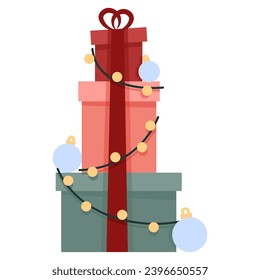 Christmas gift boxes stand on top of each other tied with ribbon
