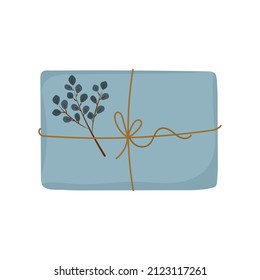 Christmas gift in craft packaging. Decorated with natural materials, eucalyptus sprigs. Cute clip-art in doodle style. Vector illustration, hand-drawn
