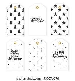 Christmas gift labels. Set Christmas gift tags in black and white colors with Christmas trees, stars and lollipops. Hand lettering. Vector seasonal badge design