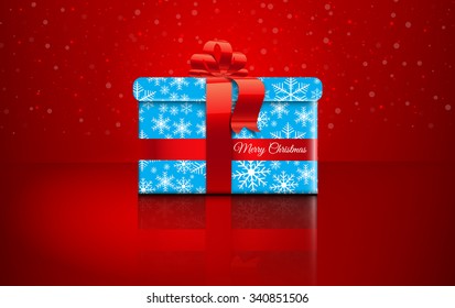 Christmas gift on red background with snow and snowflakes. Merry