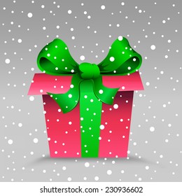 The Christmas gift and snow on the gray background