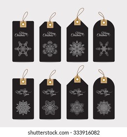 Christmas gift tags with hand drawn decorative elements.  White snowflakes on black background.