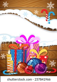 Christmas gifts, baubles and candy canes on a wooden background