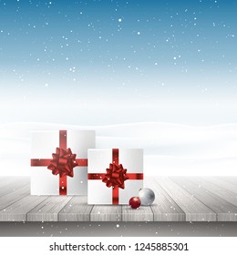 Christmas gifts and baubles on a wooden table looking out to a snowy landscape