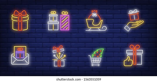 Christmas gifts neon sign set. Present box in hand, sleigh, tree in shopping cart, mail. Vector illustration in neon style, bright banner for topics like Xmas, New Year, December sale