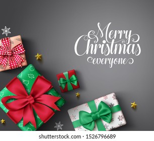 Christmas gifts vector banner background. Merry christmas greeting typography text in empty space for messages with colorful xmas gift, snowflakes and stars elements in gray background.