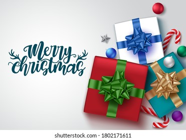 Christmas gifts vector banner template. Merry christmas greeting text in white empty space for messages with colorful gift and xmas decor elements. Vector illustration