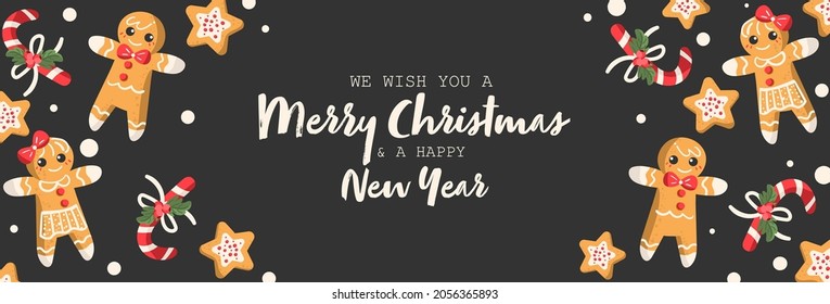 Christmas ginger bread in boy, girl and star shape and candy canes decorated with holly berry branch on black background with Merry Christmas and a Happy New Year text design for banner, frame.