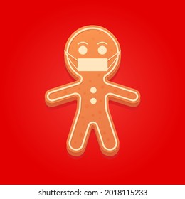 Christmas Gingerbread Man in a medical mask on red background. New Year sweet cookie during the coronavirus pandemic