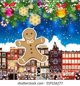 Christmas gingerbread man on the background of snow-covered streets. Green branches of Christmas trees decorated with Christmas balls and sweets. Christmas background.