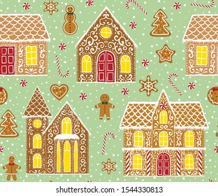 Christmas gingerbread seamless pattern with gingerbread houses on green background