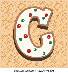 Christmas gingerbread in the shape of a letter C with white icing doodle