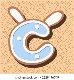 Christmas gingerbread in the shape of the letter with rabbit ears, white blue glaze, polka dots