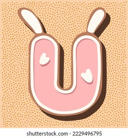 Christmas gingerbread in the shape of the letter with rabbit ears, white pink glaze, hearts