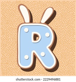 Christmas gingerbread in the shape of the letter with rabbit ears, white blue glaze, polka dots