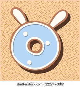 Christmas gingerbread in the shape of the letter with rabbit ears, white blue glaze, polka dots