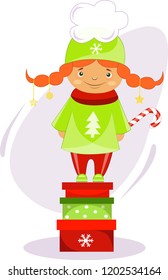 Christmas girl standing on Christmas gifts with Christmas candy
