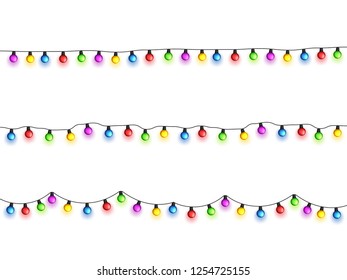 Christmas glowing lights on white background. Garlands with colored bulbs. Xmas holidays. Christmas greeting card design element. New year,winter.