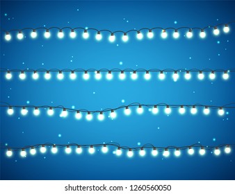 Christmas glowing lights on white background. Garlands with colored bulbs. Xmas holidays. Christmas greeting card design element. New year,winter.