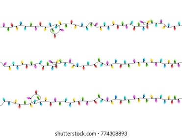 Christmas glowing lights on white background. Garlands with colored bulbs. Xmas holidays. Christmas greeting card design element. New year,winter.