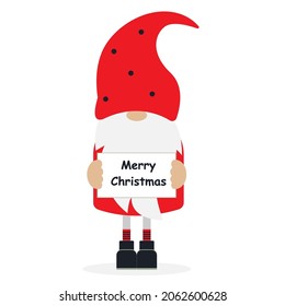 Christmas gnome holding a sign Merry Christmas.