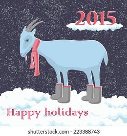 Christmas goat in the scarf in the snow greeting card