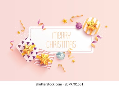 Christmas greeting banner design with gifts, balls and golden ribbon. New year decorations. Top view.