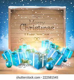 Christmas greeting card with blue gift boxes and wooden sign 