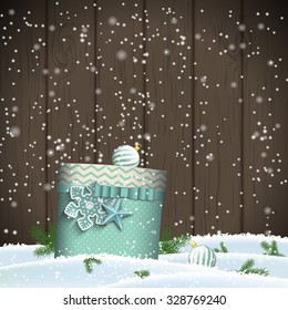 Christmas greeting card with blue present on dark wooden background, winter theme, vector illustration, eps 10 with transparency and gradient mesh