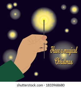Christmas greeting card concept. Bengal fire in hand. A magical atmosphere.