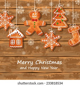 Christmas greeting card with funny watercolor gingerbread cookies hanging on a wooden boards background. Vector illustration