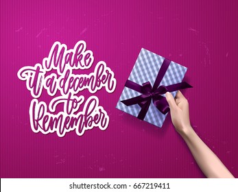 christmas greeting card with gift box . Hand drawn calligraphy. concept handwritten make it a december to remember