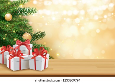 Christmas greeting card with gifts boxes on wooden table and tree bokeh background. Xmas and happy new year.