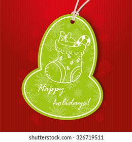 Christmas greeting card with green tag. Vector illustration