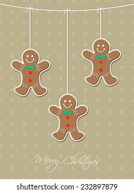 Christmas greeting card with hanging gingerbread man.