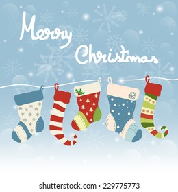 Christmas greeting card with hanging socks. Merry Christmas lettering, vector illustration