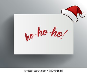 Christmas greeting card with ho-ho-ho and red Santa Claus hat.