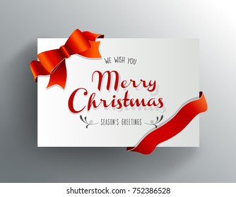 Christmas greeting card with Merry Christmas wishes and red ribbon.