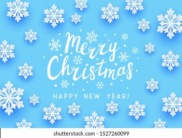 Christmas greeting card with paper snowflakes on blue background for Your holiday design