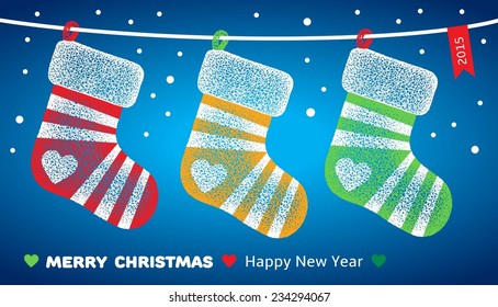 Christmas greeting card with socks hanging on blue background