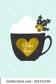 Christmas greeting card template in blue, gold, white and black. Coffee cup decorated with whipped cream and holly on snowflakes background. Gold foil heart with hand lettered text "Winter Time".